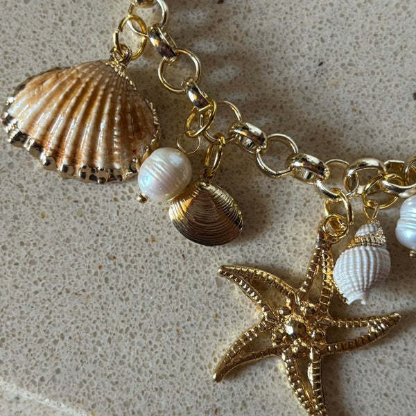 gold charm shell necklace