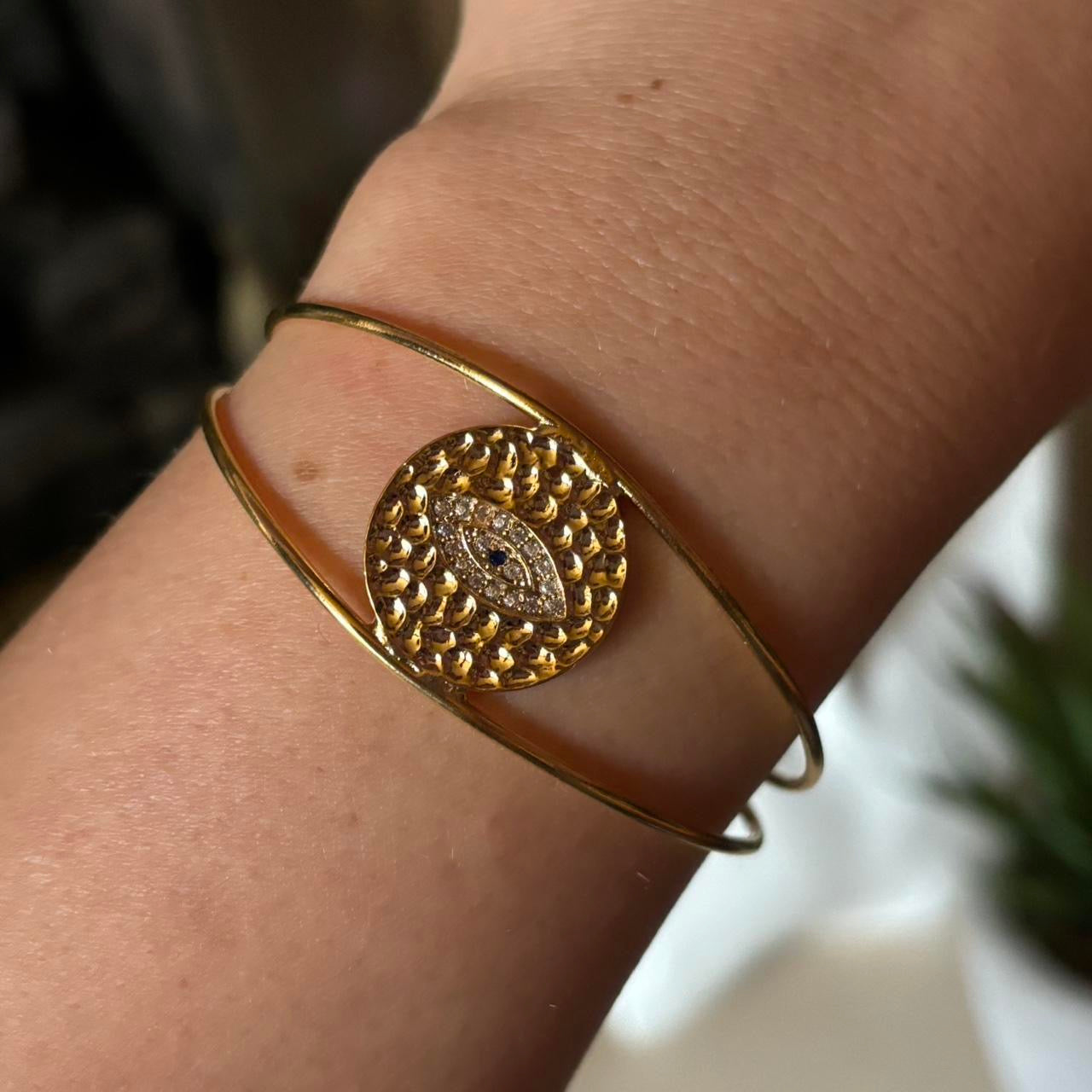 evil eye hammered bangle in gold