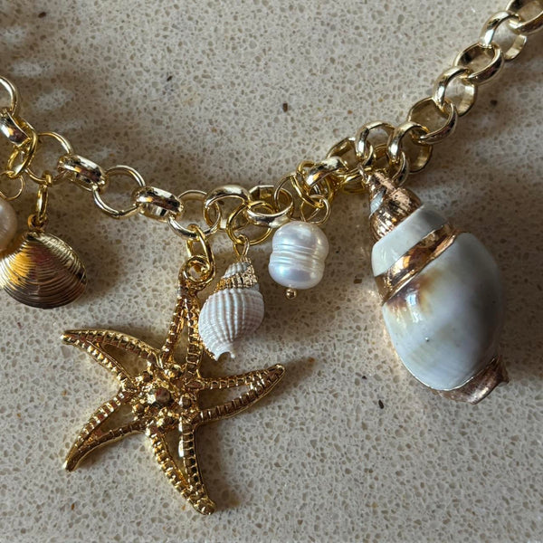 gold charm shell necklace