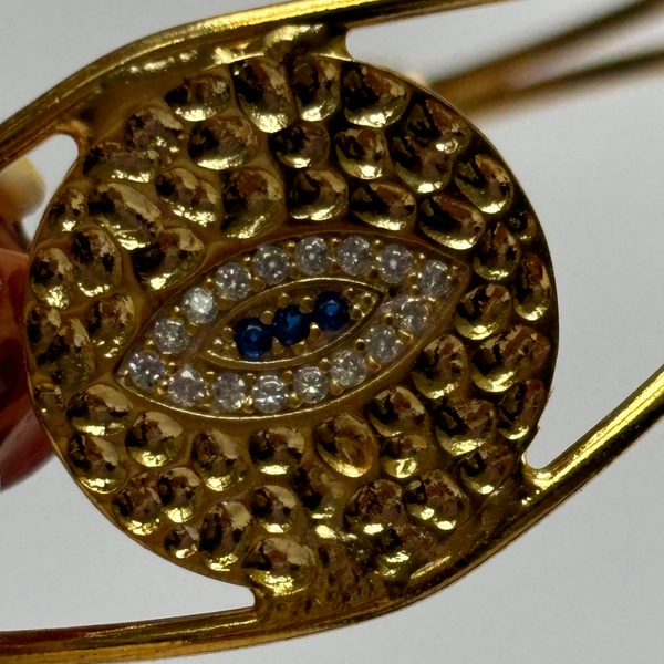 evil eye hammered bangle in gold