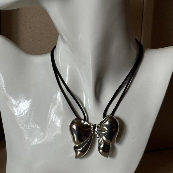 oversized silver ribbon bow necklace