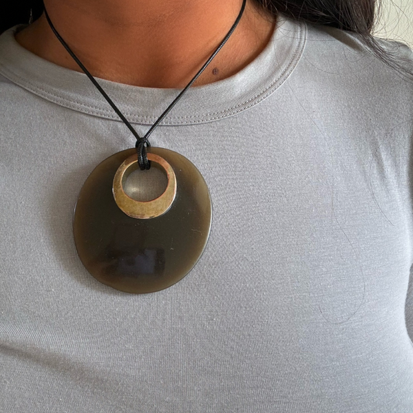 oversized oval pendant in brown and gold