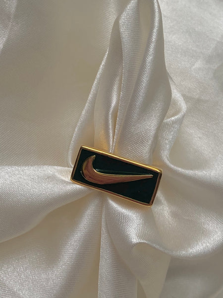 emerald swoosh ring