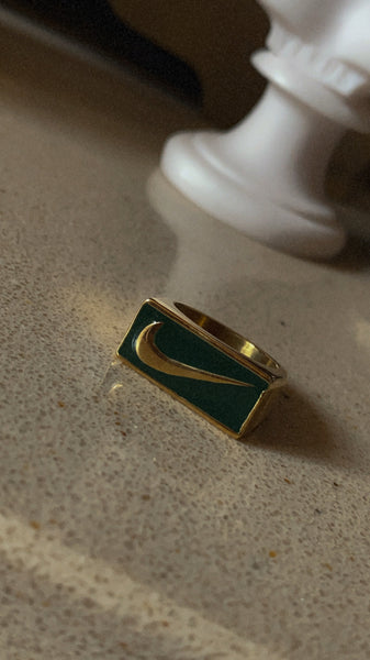 emerald swoosh ring