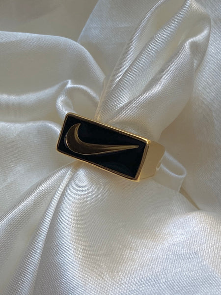 Black swoosh ring